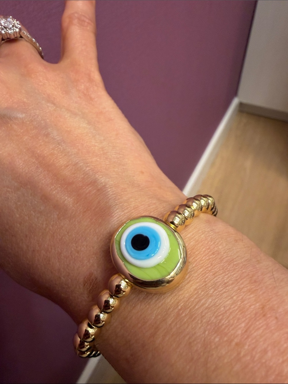 Gold Beaded Bracelet with Green Eye Charm